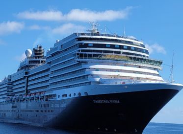 blue cruise ship from the front