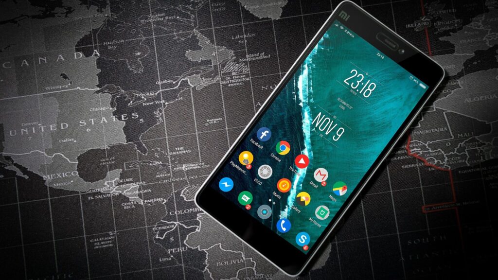 cell phone on top of map