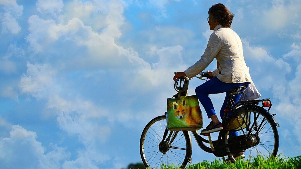 man on bike with bluie sky