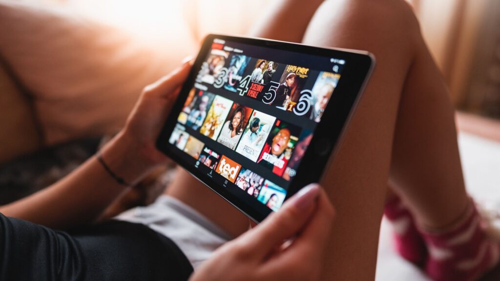 woman watching Netflix on tablet