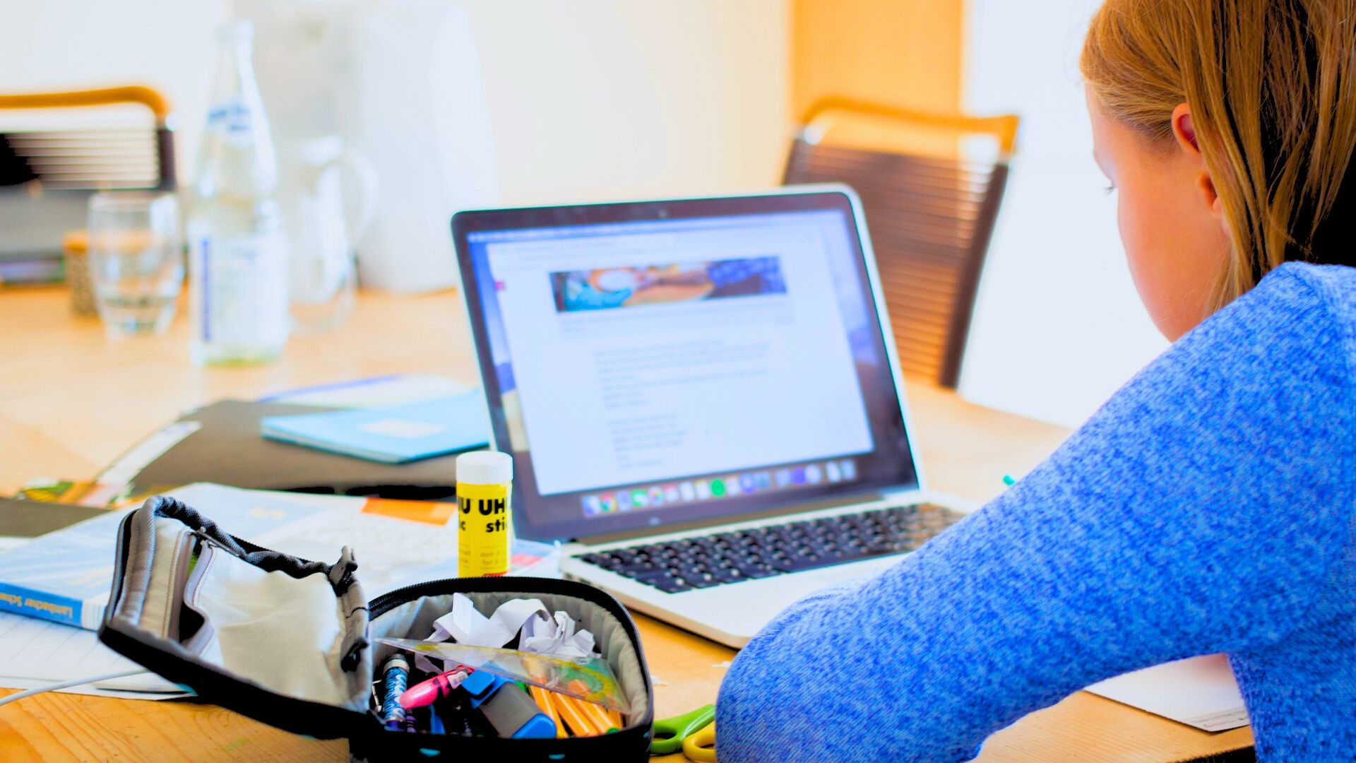woman working on laptop at table